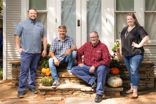 The Faces of SMCC: Shawn Cowdin, Owner and President; Selina Davis, Office Manager; Justin Cowdin, Project Manager; and Travis Laminack, Project Development and Estimator