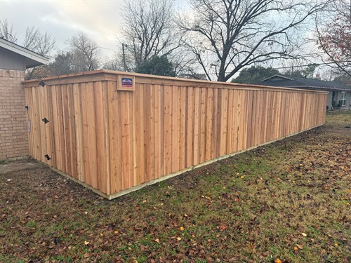 6' natural cedar fence in the board-on-board style with top cap and trim installed by Stand Strong Fencing of Fort Worth