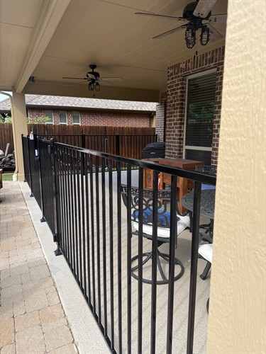Ornamental steel fencing with self-closing hinges and magnalatch on gates installed by Stand Strong Fencing of Fort Worth