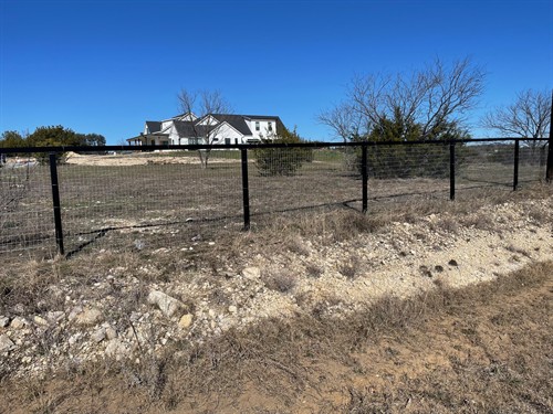 Pipe fence with no-climb installed by Stand Strong Fencing of Fort Worth