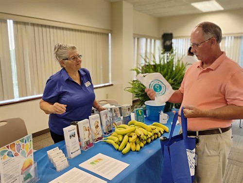 Gallery Image CC_Employee_Health_Fair_Glenda_with_attendee_pg.jpg