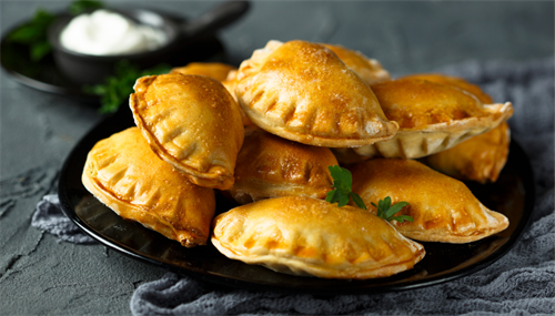 Single Beef Pies filled with well-seasoned and cooked lean ground beef, carrots and potatoes