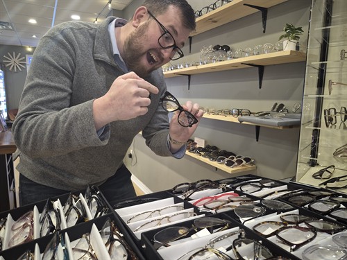 West Sight Optical's expert optician helping a patient choose the perfect glasses frames in London, Ontario. We offer complimentary frame styling consultations — matched to your face shape, prescription, and lifestyle needs.