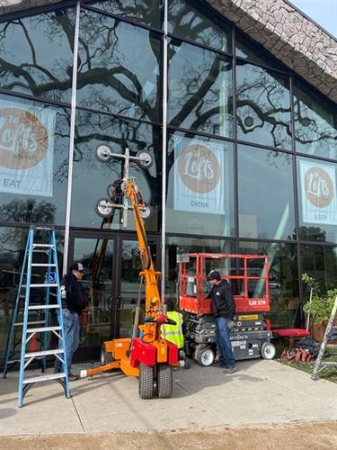 Commercial glazing contractors with specialty equipment
