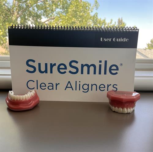 Looking to straighten your teeth but don't want traditional braces? Call us to consult about our clean aligners, Sure Smile! Looking to straighten your teeth but don't want traditional braces? Call us to consult about our clean aligners, Sure Smile!