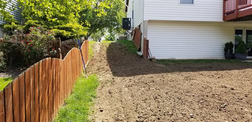 Regraded a backyard, getting rid of a large hole that was there.