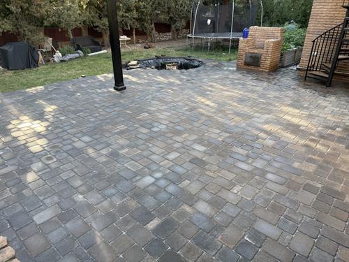 Paver patio overlay with bullnose coping on the steps.