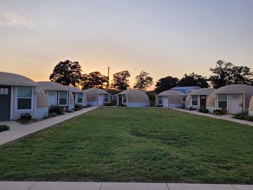 Eleven private domes surround a shared courtyard near Bellville, TX.
