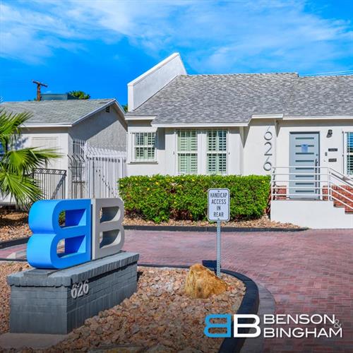 The logo of Benson & Bingham Car Accident & Personal Injury Lawyers stands proudly on the brick wall, a clear mark of their commitment to clients in Las Vegas.