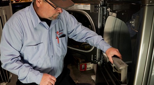 Gallery Image Mr._Appliance_Servicing_a_Dryer_in_Town_and_Country.jpg