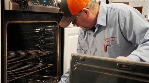 Gallery Image Robert_Harris_Master_Technician_from_Mr._Appliance_of_Spokane_Valley_Inspects_an_Oven_and_Stove_Range.jpg