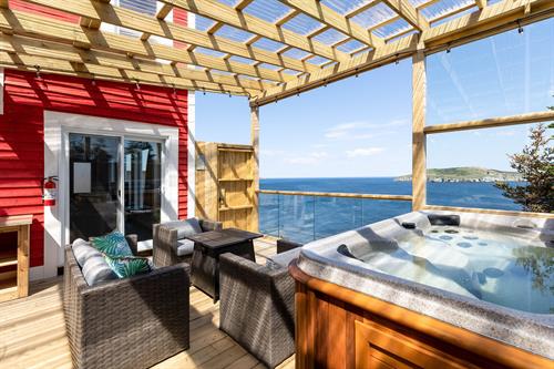 Gallery Image EaglesNest_-_Living_Room_and_Hot_Tub_with_Views_of_Ecological_Reserve_Islands.jpg