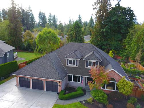 Cornerstone Roofing, Inc. installed a CertainTeed Presidential TL Charcoal Black luxury asphalt shingle roof on this Bothell home.