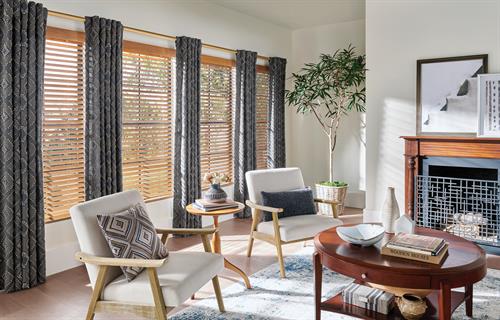 Real Wood Blinds with decorative drapery side panels to accent and highlight the room and windows.