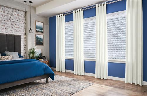 Sheer Shades with decorative drapery panels to highlight and accent the room and windows.