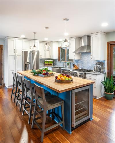Bright Blue Kitchen with Butcherblock countertop island