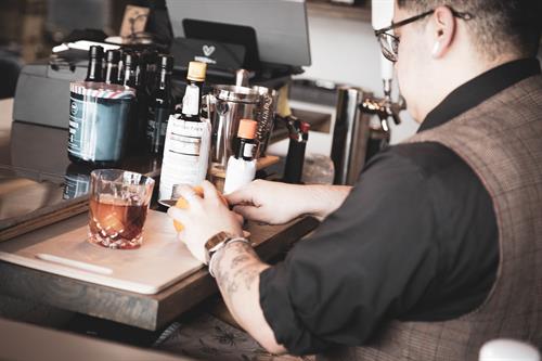 Making a complimentary Whiskey Old Fashioned