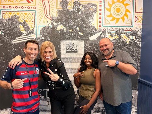 The Fuzzy’s Taco Shop management team, Jason, owner of RAD Racing, and I. Both are valued Perks Members of The Livable Forest®, helping us connect residents with local businesses, experiences, and community favorites.