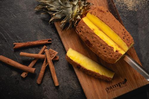 Caramelized Pineapple - Grilled over open flame, sprinkled with a blend of sugar and cinnamon for a sweet, smoky flavour