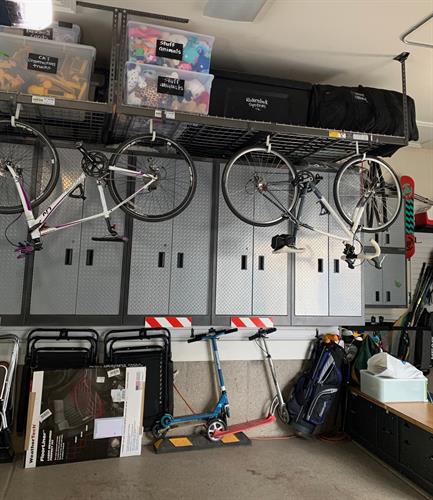 Garage with camping, biking, hockey, lacrosse gears with 4 kids