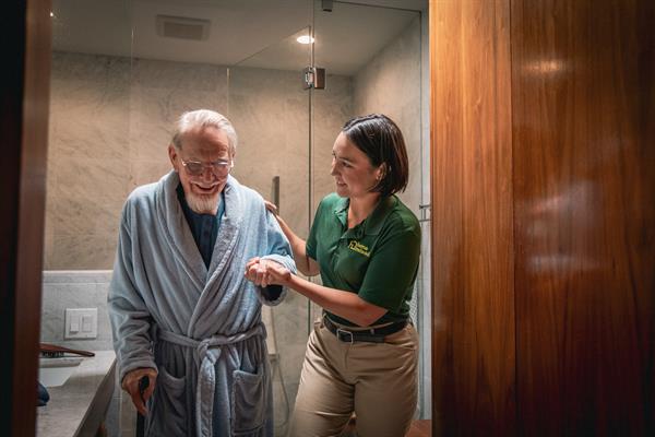 caregiver with shower assist