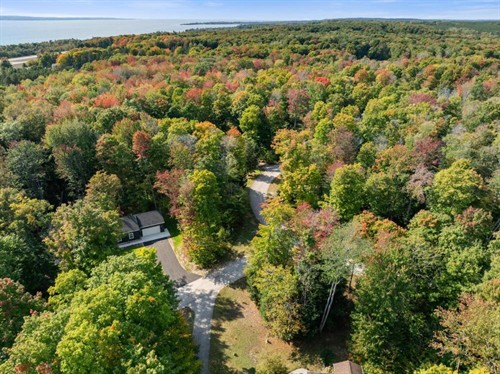 Aerial view: the house in the woods between Harbor Springs and Petoskey, Little Traverse Bay beyond