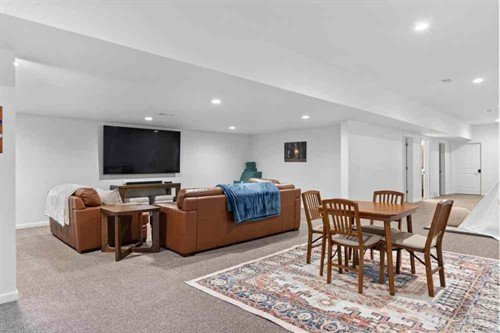 Second living room on the lower level: TV lounge and game table
