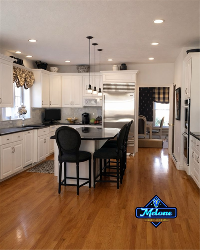 Kitchen rewire with modern recessed lighting and fixture upgrade in Rhode Island by Melone Electric.