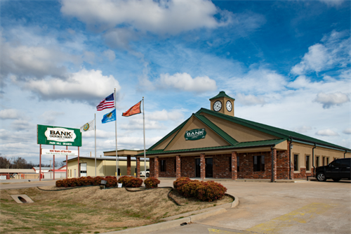 Front shot of the Bank of Cherokee County Park Hill branch in Tahlequah, Oklahoma on a sunny day. Front shot of the Bank of Cherokee County Park Hill branch in Tahlequah, Oklahoma on a sunny day.