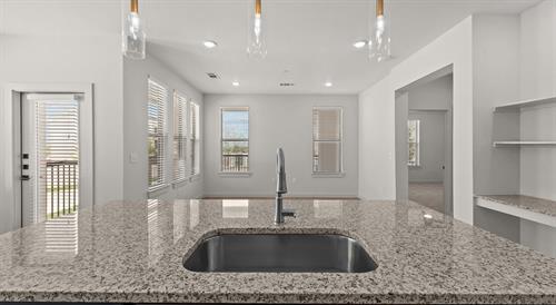 Kitchen space with granite countertops.