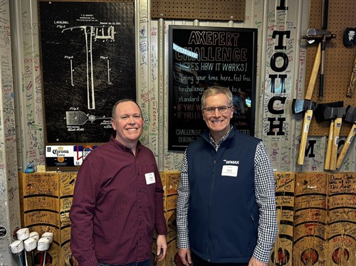 Friends and local professionals enjoying axe throwing at a Greater Nashua Chamber of Commerce event at Axe Play