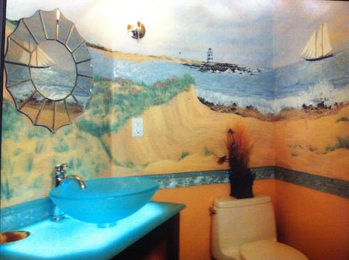 Custom mural depiting family history of Prince Edward Island for interior bathroom with underlit counter and glass vessel sink.