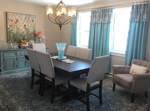 Updated Dinning room with repurposed buffet with custom decorative paint finish to coordinate with room.