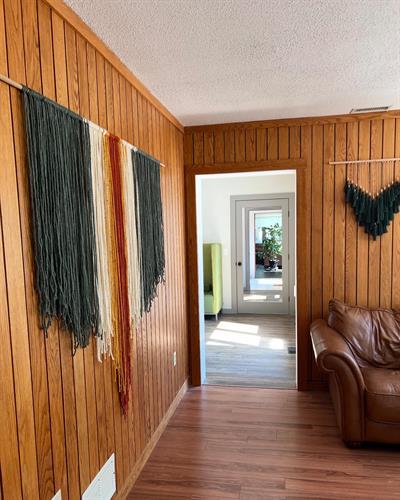 Walkway between private offices and open work space 