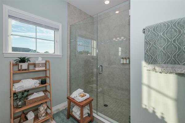 Full bathroom 1 in primary bedroom suite - large glass walk-in shower