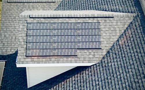 Seamless solar shingles integrated with premium roofing for a clean, modern look and lasting energy savings.