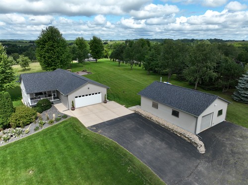 Fresh new look! Both the home and garage now feature sleek, modern roofs that enhance curb appeal and tie the property together beautifully.