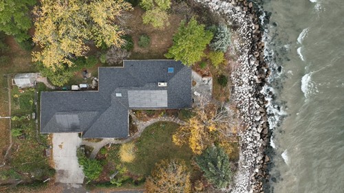 Certainteed Solstice shingles are built to withstand the toughest lakeside weather while delivering clean energy.
