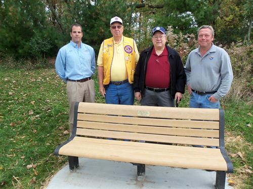 The Lions have installed 3 benches, a picnic table, little library, and planted trees in Tower Park.