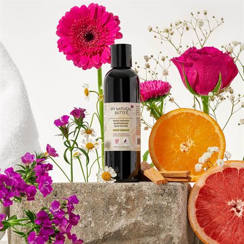 Sweet Embrace Triple Whipped Body Butter — a soft, floral-inspired blend that melts into skin for lasting comfort.
