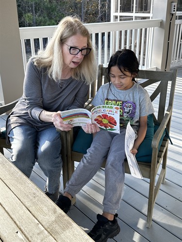 Ms. Wendy reading to Aramis as part of our Grandparents Read program.