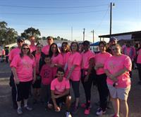 BECi employees participating in a breast cancer awareness walk. 