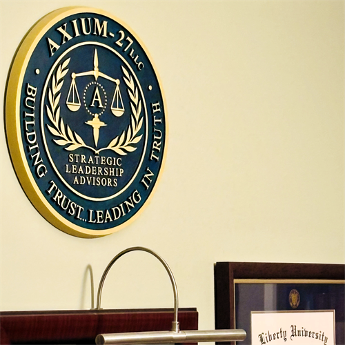 Gallery Image In-Office_Wall_Logo_of_Axium-27_and_Diploma.png