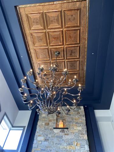 Copper Ceiling Tiles Paired With Exquisite Chandelier