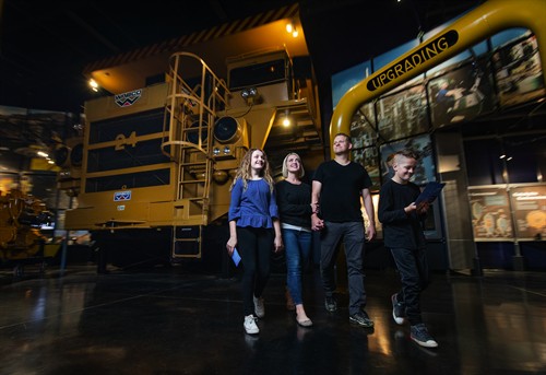 Family in front of Big Truck.