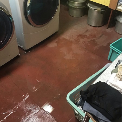 Water inside laundry room.