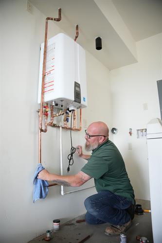 Lewis, our service manager, installing a new tankless water heater!