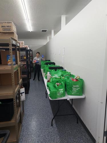 Volunteers sorting thousands of lbs of YFNP Green Bag food donations