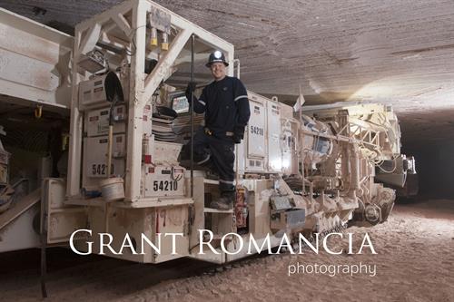 business portrait of operator on a mining drill