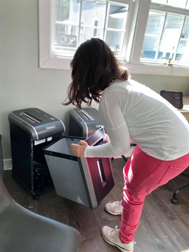 Gallery Image Chloe_putting_shred_drawer_back(1).jpeg